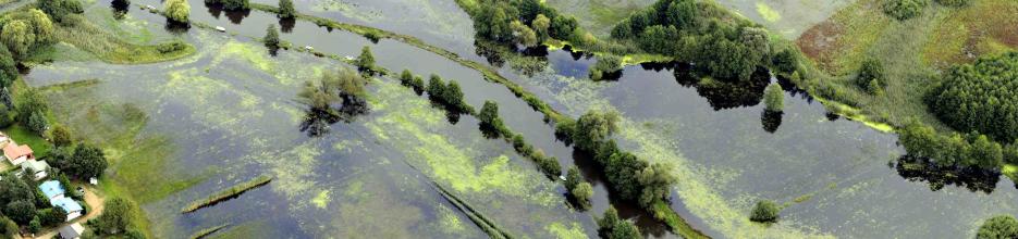 Floodplains are hotspots of ecosystem services. The picture shows a submerged floodplain and indicates conflicts of use with existing settlements.